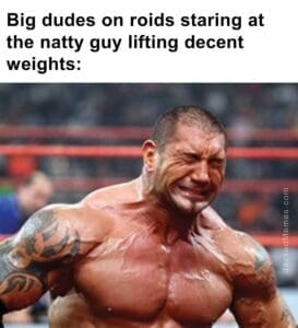 Big dudes on roids staring at the natty guy lifting decent weights