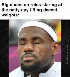 Big dudes on roids staring at the natty guy lifting decent weights