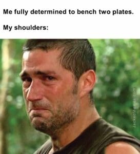 Me fully determined to bench two plates.  my shoulders