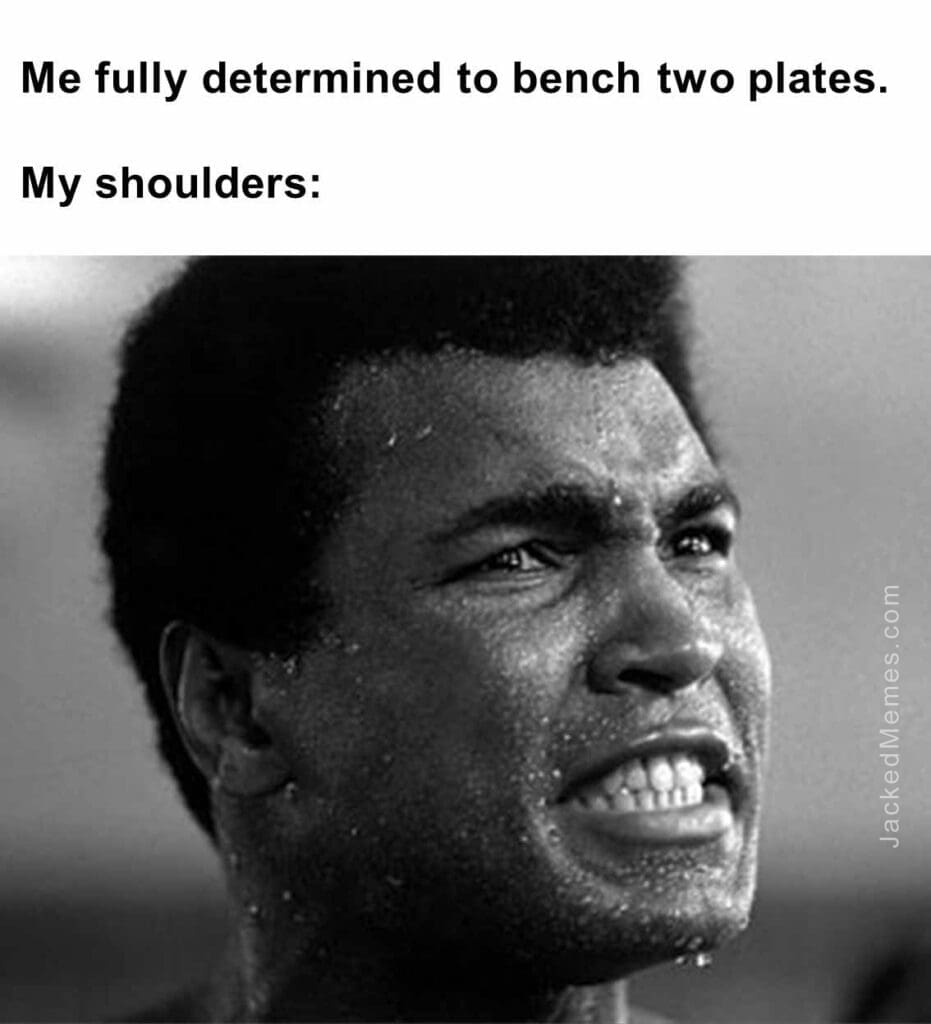 Me fully determined to bench two plates.  my shoulders